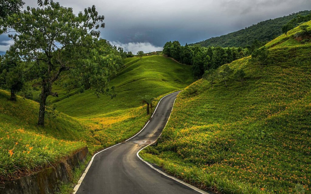 hills-surrounding-narrow-country-road-pdup696w02n5js8g